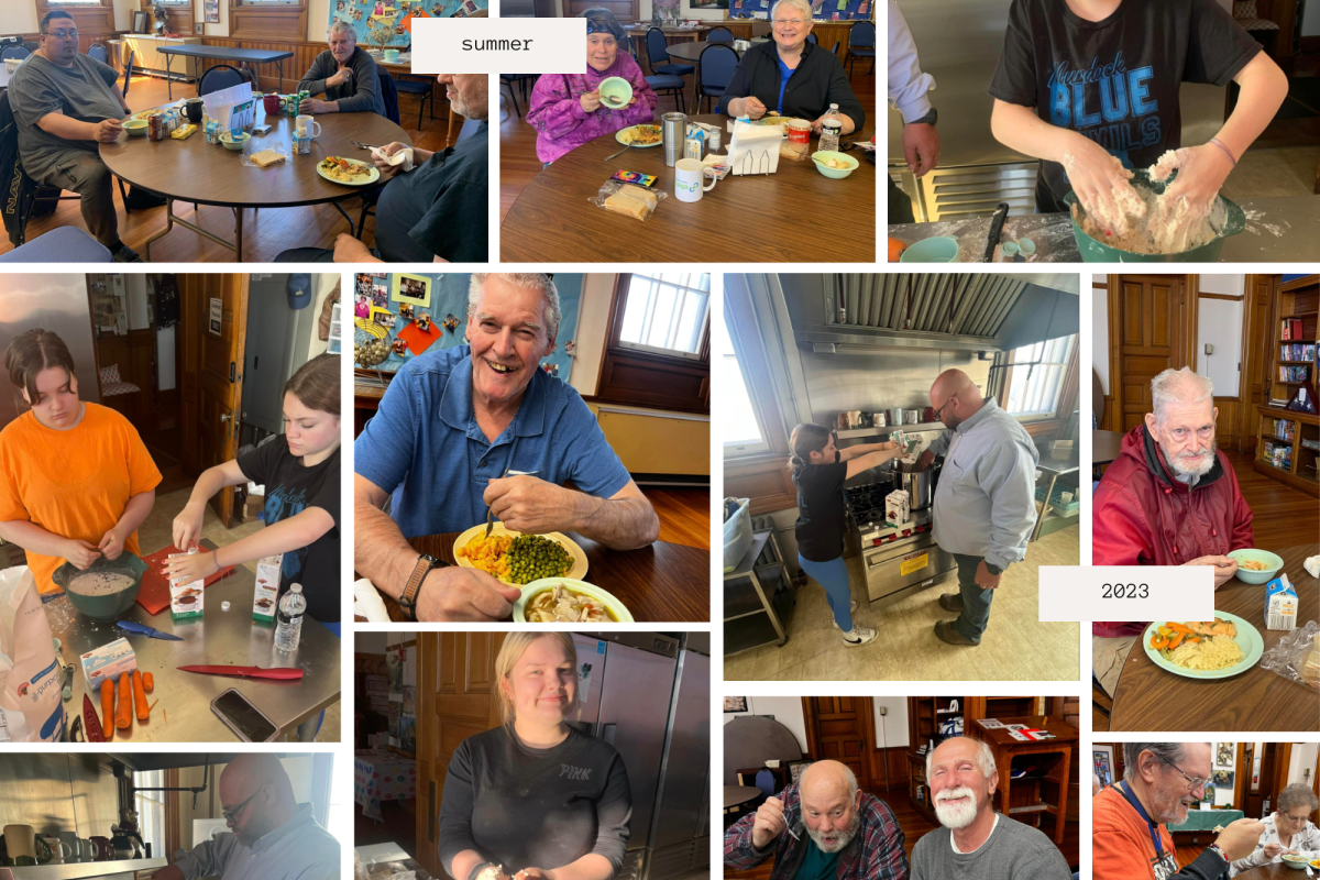 Teens cook in a kitchen. Seniors seated at tables eat soup, pasta, and vegetables.